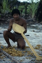 COLOMBIA, North West Amazon, Tukano Indigenous People, Makuna man making a typical Vaupes canoe