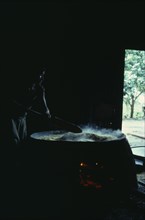 COLOMBIA, North West Amazon, Tukano Indigenous People, Barasana woman making casabe bread from
