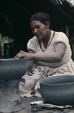 COLOMBIA, North West Amazon, Tukano Indigenous People, Barasana woman Paulina making clay cooking