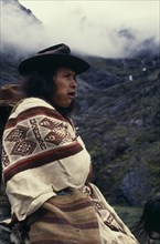 COLOMBIA, Sierra Nevada de Santa Marta, Ika, Portrait of Ika shepherd wrapped in woven wool&cotton