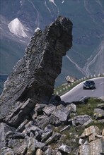 AUSTRIA, Hohe Tauern, High Tauern N. Park, Witches Kitchen rock formation above car on