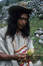 COLOMBIA, Sierra Nevada de Santa Marta, Ika, Ika man in traditional dress with hand woven mochila