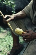 COLOMBIA, Sierra Nevada de Santa Marta, Ika, Cropped detail of Ika man holding a poporo small gourd