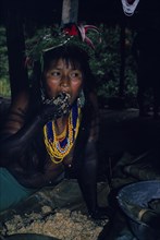 COLOMBIA, Choco, Embera Indigenous People, "Young Embera daughter painted with black dye extracted