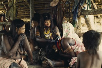 COLOMBIA, Choco, Embera Indigenous People, "Embera family group with young women painted with black