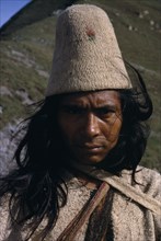 COLOMBIA, Sierra Nevada de Santa Marta, Ika, Portrait of Ika man in traditional dress.Helmet made