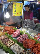 KOREA, South, Seoul, "Namdaemun - Namdaemun Market, December evening, food stall with chicken,