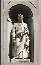 ITALY, Tuscany, Florence, Statue of the poet and writer Giovanni Boccaccio in the Vasari Corridor