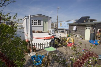 ENGLAND, West Sussex, Shoreham-by-Sea, Houseboat moored along the banks of the river adur.  Former