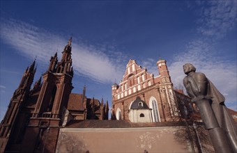 LITHUANIA, Vilnius, Saint Francis and Bernardine Church behind the Adam Mickiewicz statue