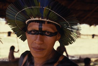 BRAZIL, Mato Grosso, Indigenous Park of the Xingu, Head and shoulders portrait of young male Panara