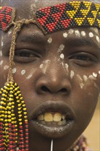 ETHIOPIA, Mago National Park, Karo Tribe, Karo girl with face painting.