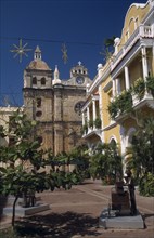 COLOMBIA, Bolivar, Cartagena, Plaza de San Pedro Claver.  Yellow and white colonial facade of