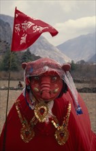 NEPAL, Annapurna Region, Larjung, Circuit Trek. Red painted animal totem representing the God of