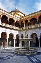 SPAIN, Andalucia, Seville, "House of Pilatos, Building and fountain in the courtyard."