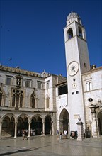 CROATIA, Dalmatian Coast, Dubrovnik, "Bell tower and Sponza Palace, Luza Square, Stradun. Former