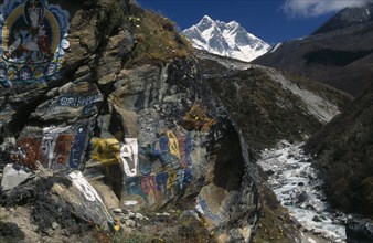 NEPAL, Everest Trek, Pangboche, Buddhist wall paintings beside the trail between Pangboche and