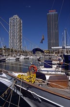 SPAIN, Catalonia, Barcelona, "Port Olimpic, Bow of yacht, marina, Hotel Arts and Torre Mapfre"