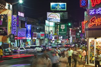 INDIA, Karnataka, Bangalore, "Brigade Road at night, retail and entertainment centre for