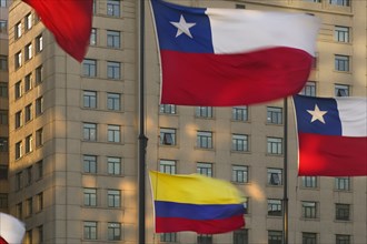 CHILE, Santiago, Chilean national flags flying in Plaza de la Constitucion.