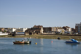 ENGLAND, West Sussex, Shoreham-by-Sea, View across the river Adur from the footbridge toward the