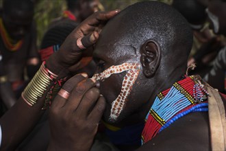 ETHIOPIA, Lower Omo Valley, Turmi, "Hama Jumping of the Bulls initiation ceremony, Face painting