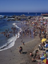 CHILE, Valparaiso Region, Los Lilenes, Crowded beach near Vina del Mar.  People sunbathing and