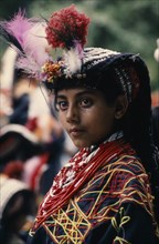 PAKISTAN, North West Frontier, Bumburet, Young Kalash girl wearing traditional dress at the