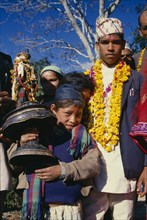 NEPAL, East,  Sangawa Khola, The groom in a wedding procession wearing a marigold garland in the