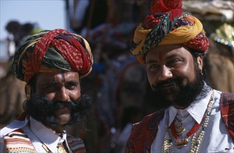 INDIA, Rajasthan, Bikaner, Two Rajput men with beards wearing ceremonial dress and turbans at the