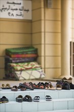 UAE, Dubai, Shoes left at the entrance to a mosque.