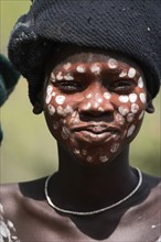 ETHIOPIA, South Omo Valley, Mursi Tribe, Boy with face painting