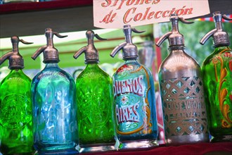 ARGENTINA, Buenos Aires, Soda syphons for sale in the San Telmo flea market in Plaza Dorrego