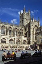 ENGLAND, Somerset, Bath, "Bath Abbey, classical guitarist and tourists, Bath, Somerset, England "