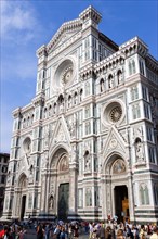 ITALY, Tuscany, Florence, "Tourists in front of the Neo-Gothic marble west facade of the Cathedral