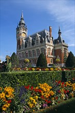 FRANCE, Nord Picardy, Pas-de-Calais, "Calais, colourful flowers and Town Hall."