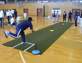 JAPAN, Honshu, Tokyo, "Chiba, Nosaka -at town gym, adults, all over fifty years old, playing