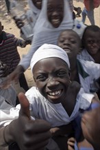 GAMBIA, Western Gambia, Tanji, "Tanji Village.  Happy, laughing children wanting to be photographed