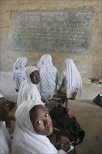 GAMBIA, Western Gambia, Tanji, Tanji Village.  African Muslim girls wearing white headscarves