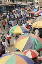 GAMBIA, Western Gambia, Serekunda, "Bakau Market, Atlantic Road.  Busy city street lined with