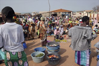 GAMBIA, Western Gambia, Tanji, Busy market scene with women selling fruit and vegetables and