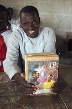 GAMBIA, Western Gambia, Tanji, Tanji village.  Smiling student from Usman Bun Afan private Islamic