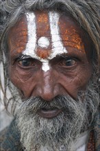INDIA, Rajasthan, Udaipur, "Portrait of elderly male Hindu beggar outside the Jagdish Temple.  With