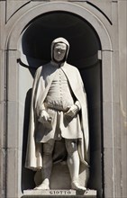 ITALY, Tuscany, Florence, Statue of architect and painter Giotto di Bondone in the Vasari Corridor