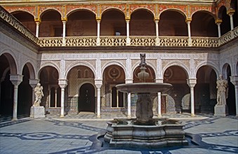 SPAIN, Andalucia, Seville, "House of Pilatos, Building and fountain in the courtyard."