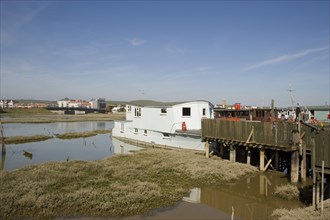 ENGLAND, West Sussex, Shoreham-by-Sea, Houseboats moored along the banks of the river adur.