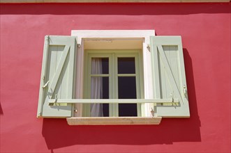 GREECE, Ionian Islands, Kefalonia, "Lixouri, Stil Tipaldou, Green and cream window and pink wall of