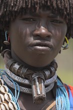 ETHIOPIA, Lower Omo Valley, Key Afir, Banner woman wearing a necklace know as a Bignere - an metal