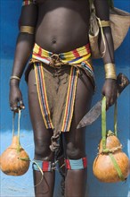 ETHIOPIA, Lower Omo Valley, Key Afir, Tsemay woman traditionally dressed at weekly market