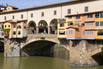 ITALY, Tuscany, Florence, The 14th Century Ponte Vecchio bridge across the River Arno showing the